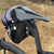 The bag will attach to oval seatposts like this style because the back edge of the post is nearly round (pix is an old style 4.8 bag, which uses the same hardware as the current 2.3 bag). Shown on a Pinarello gravel bike.