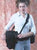 Sling a Y315 (or heavier Y515) shoulder strap across your chest and attach to a holster case for additional support.