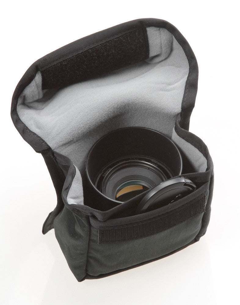The front slip pocket of the F102 holds lens caps (pouch interior is now orange colored).