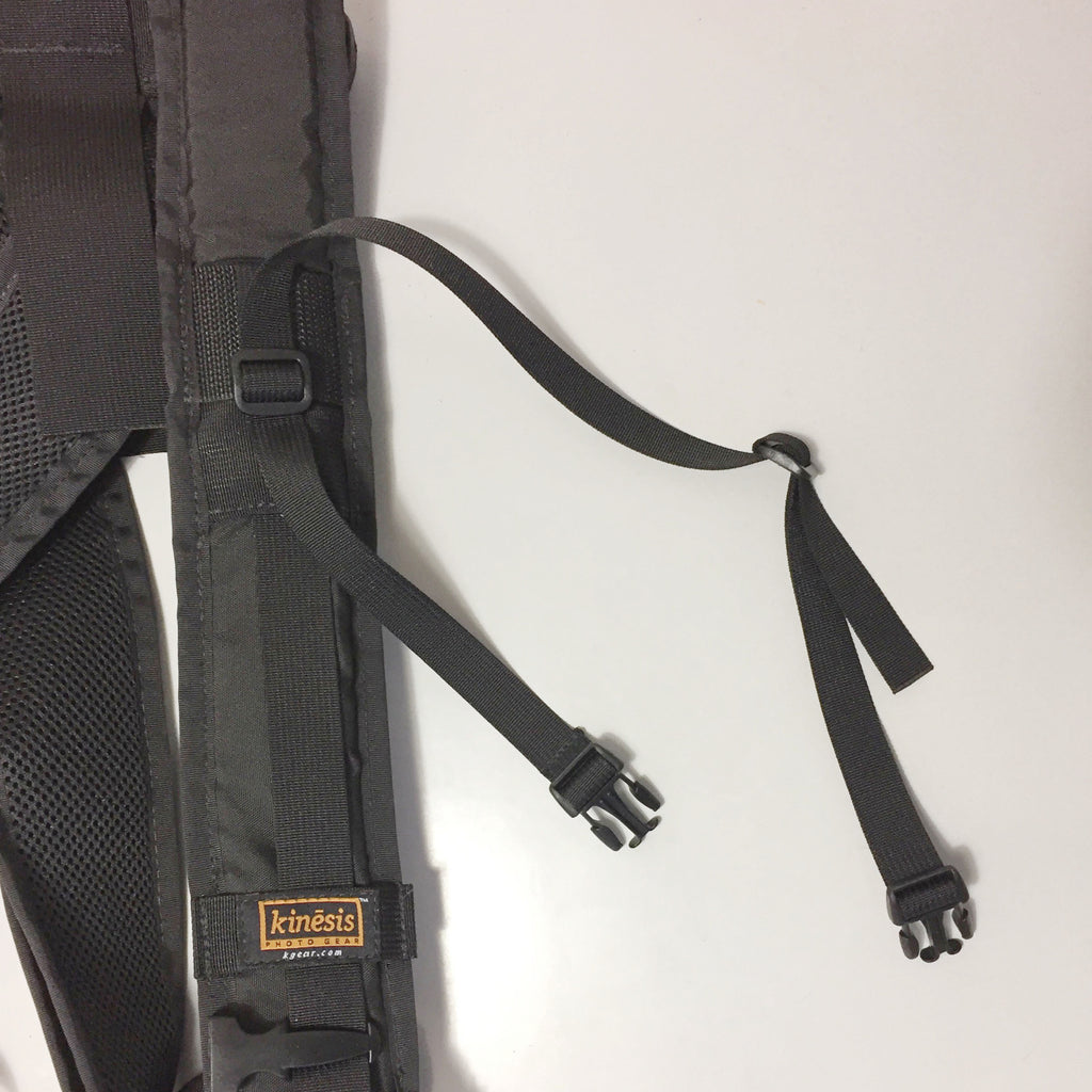 INSTRUCTIONS: front detail ~ remove the existing strap (if there is one) & replace it with this long strap. Be sure to double back the webbing through the “slider” buckle. The male buckle on the left attaches to the front camera and the other buckle attaches to the camera on your side.