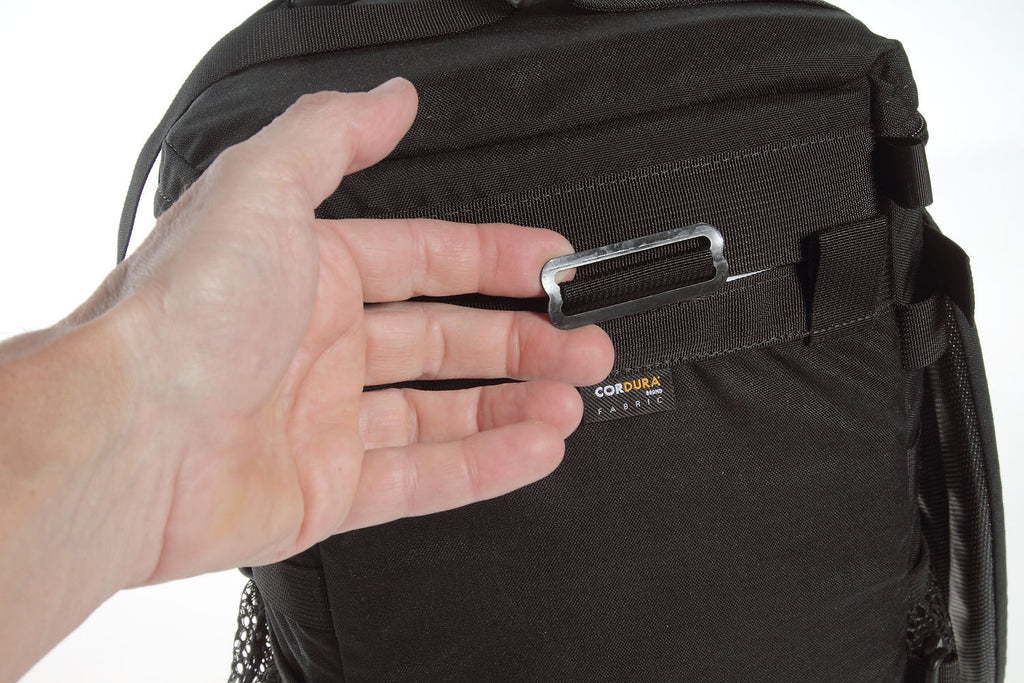 Metal slider on the back of the case for attaching a backpack harness (covered by the lid when not in use).