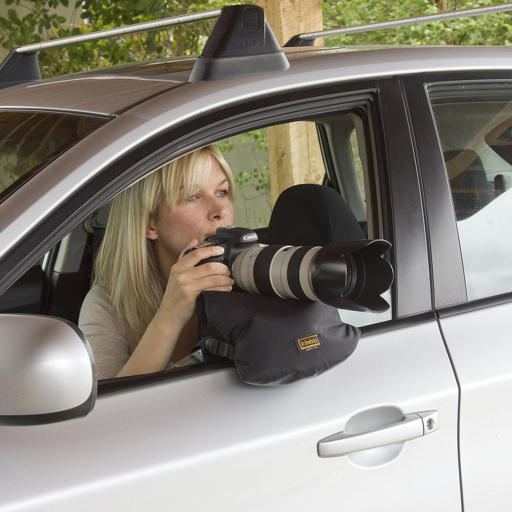 Saddlebag style on a car door. Raising the window a little bit helps stabilize it.