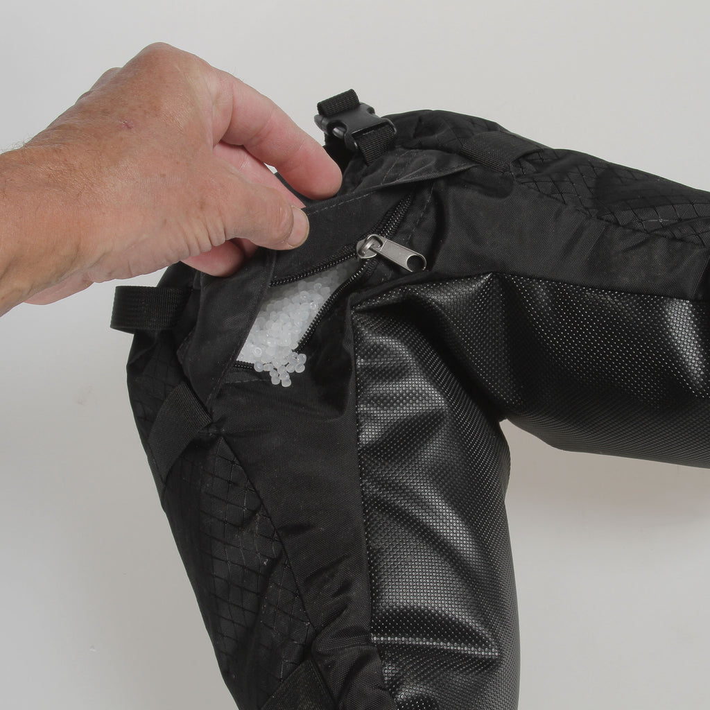 A covered zippered opens to allow filling or emptying of fill.