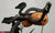 Single strap securing a 2L stuff sack to a pair of aerobars.
