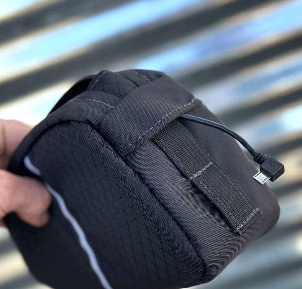 With version 3.0 there is now a covered cable port (large bag show, but medium is similar).