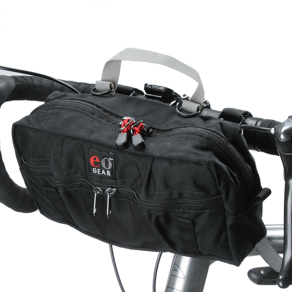 Pack attached to a bike, illustrating the sewn-in hand grab loop.