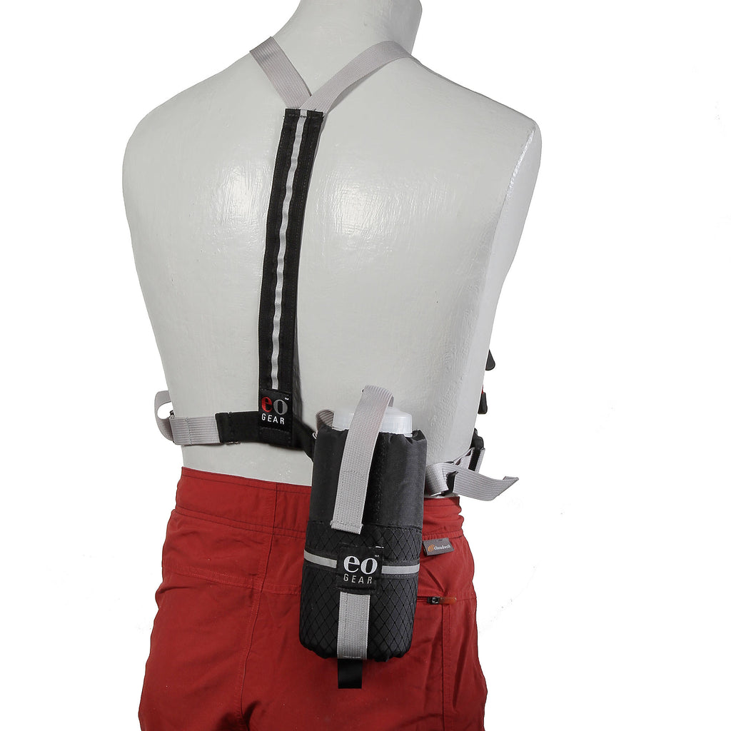 The 0.8 Bottle Pouch (or any other pouch with dual tabs on the back) can be attached to the rear of the harness for extra capacity.