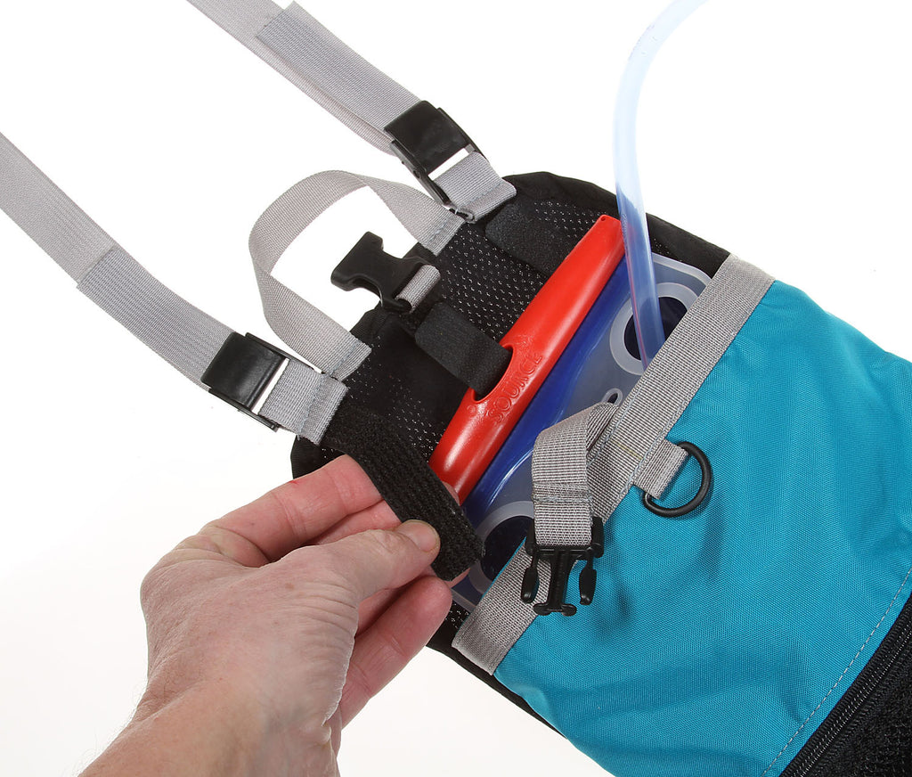 The rear module has three hook & loop straps for attaching to various bladders, keeping it near the top of the pack.