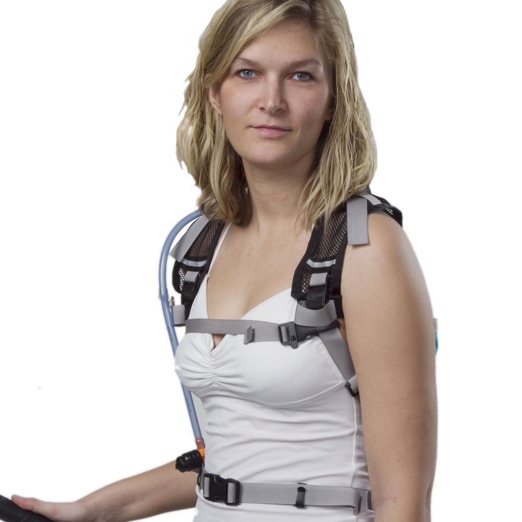 The harness features a sternum strap, but waist belt shown is part of the rear module.