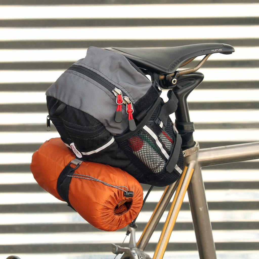 Optional accessories, like this 2L stuff sack (for a jacket) or a spare tire can be attached to the outside.