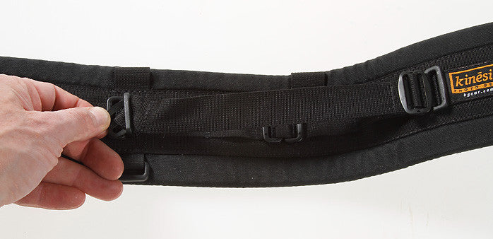Insert as shown with the slider flipped so it is underneath the fold of the webbing. Bowing the belt helps provide the necessary slack. Also visit our How To page for more details on using metal slider Twin Buckle system. 