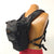 Note that the bottom straps of the harness and the torso strap clip to the bottom D-rings of the holster case.