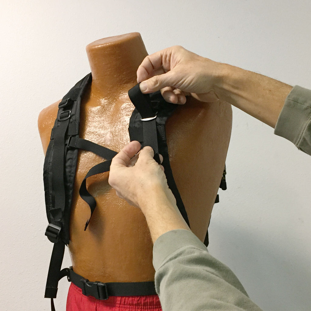 Feed the top H437 straps through the metal sliders on the harness.